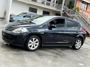 Nissan  Tiida 2009 Бензин